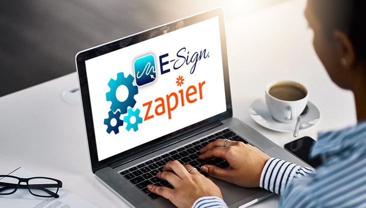 Worker Using Zapier on Laptop