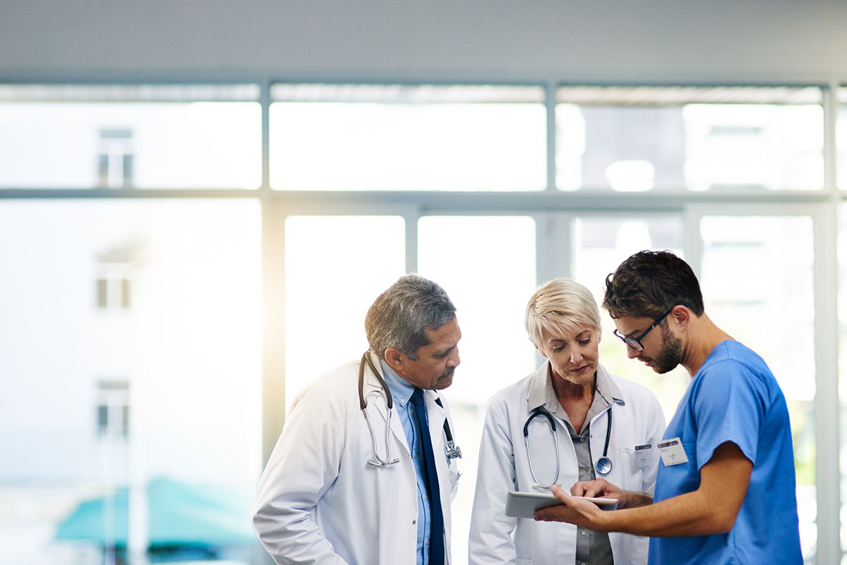 Hospital Workers Viewing Medical Template